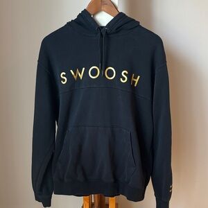 Nike Black Hoodie with Gold Swoosh Design